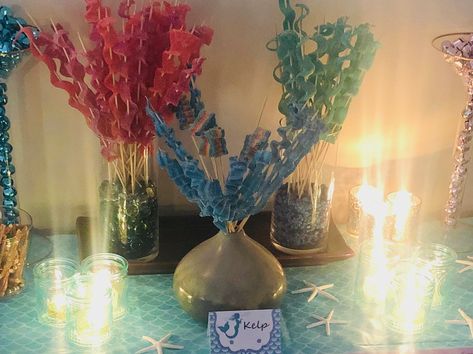 Candy kelp. Skewers and sour tape from Amazon. Seaweed Party Decoration, Making Seaweed Decorations, Kelp Watercolor, Seaweed Streamers Under The Sea, Sea Kelp Forest, Fishing Theme Party, Sea Kelp, Candy Display, Mermaid Baby Showers