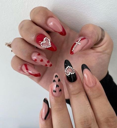 Looking for cute and romantic red Valentines Day nails ideas? Check this post for the 70+ trendy red Valentine's Day nail design ideas that you'll love! Pink Valentines Day Nails Almond, Nails Black Valentines, Valentines Day Nails Black, Dark Valentines Day Nails, Nails Acrylic Valentines Day, Valentines Day Nails Almond, Nails Short Valentines Day, Black Valentines Day Nails, Nail Designs For Valentines Day