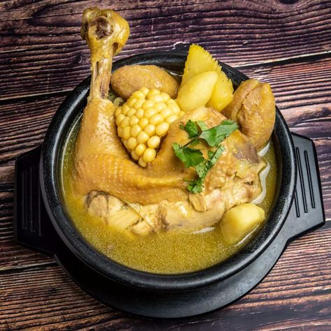 Sancocho is a hearty soup, almost like a stew and is a traditional dish in the region of Antioquia, Colombia that combines potatoes, yuca, corn, plantains and meat. For me and my family this is the ultimate comfort food and is absolutely delicious. Sancocho is a traditional chicken broth in several Latin American cuisines. The best way to eat this soup is with some salsa or cumbia music playing in the background. Columbian Sancocho, Colombian Sancocho Recipe, Colombian Sancocho, Colombian House, Columbian Food, Sancocho Recipe, Sancocho Colombiano, Columbian Recipes, Colombian Dishes