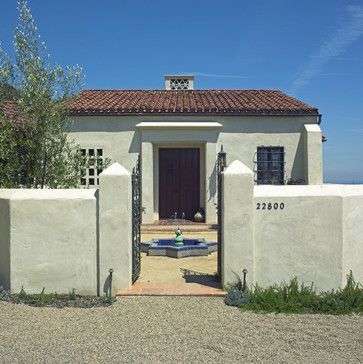 Rendered Fence, Small Spanish Style Homes, Courtyard Inspiration, White Stucco Exterior, Exterior Render, Spanish Exterior, Stucco Colors, Entry Door Designs, Mediterranean Exterior