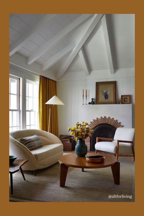 Scandinavian design makes use of neutral and natural colors with pops of earth tones for contrast. We love how this designer used pops of marigold or citron in the draperies and floral arrangement. The white vaulted ceiling, brick arch fireplace, and walls help to brighten this room up. We love the white curved armchair and 3 leg wood coffee table. Studio Shamshiri, Living Room Transitional, Yellow Sofa, Primary Suite, Living Room Scandinavian, Scandinavian Interior Design, Living Room White, Scandinavian Interior, Residential Design