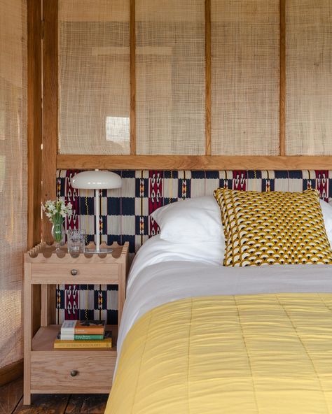 This beautiful wrap-around headboard brings tropical style to this countryside bedroom. The cane screening adds to the warmth of the space, and the earthy tones match the natural materials of the nightstand and soft furnishings. See more interesting headboard ideas at the link in bio. . Photography by Ben Stevens, interior design by @kateguinnessdesign . #homesandgardens #headboard #screen Headboard Room Divider Ideas, Headboard Room Divider, Kate Guinness, Bed Alcove, Divider Headboard, Moodboard Office, Countryside Bedroom, Fashion Art Installation, Cool Headboards