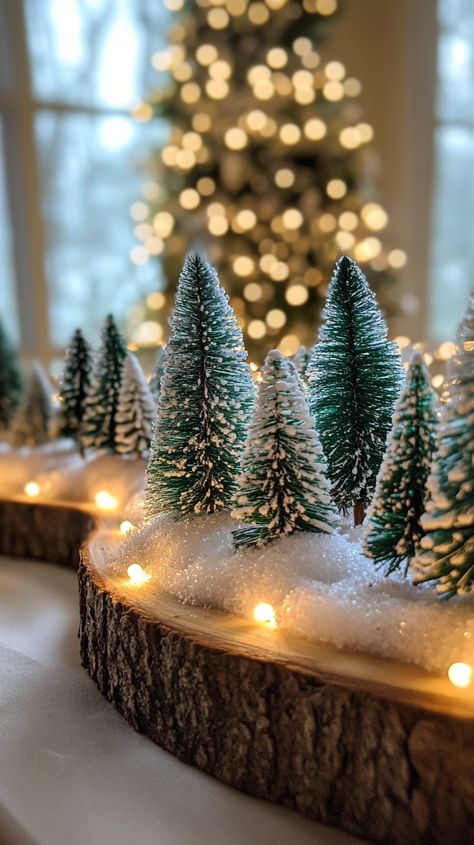 Christmas table centerpiece with snowy trees on wood slices, adorned with lights, in green and white shades for cozy decor. Wood Slice Christmas Centerpiece, Living Room For Christmas, Enchanting Table, Christmas Decorating Ideas, Christmas Decorations Living Room, Nature Inspired Decor, Miniature Trees, Christmas Living Rooms, Christmas Bedroom