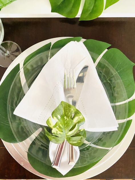 Bring the Caribbean inside with this elegant tropical dinner party. We’ll show you how to put together an easy tropical dessert table, gorgeous place settings with DIY centerpieces and napkin rings, and delicious caribbean themed party food. #tropicaldinnerparty #caribbeanparty #tablescapeideas Tropical Dessert Table, Tropical Dinner Party, Tropical Dinner, Tropical Napkins, Diy Tablescapes, Caribbean Party, Tropical Desserts, Dinner Party Table Settings, Event Planning Decorations