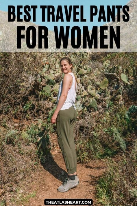 A young woman wearing a white tank top and army green stands on a steep, cactus-lined trail, with the text overlay, "Best Travel Pants for Women." Womens Travel Pants, Hiking Pants Outfit, Best Travel Pants For Women, Travel Pants For Women, Best Travel Pants, Travel Pants Women, Pant Outfits For Women, Pants For Summer, Comfy Travel