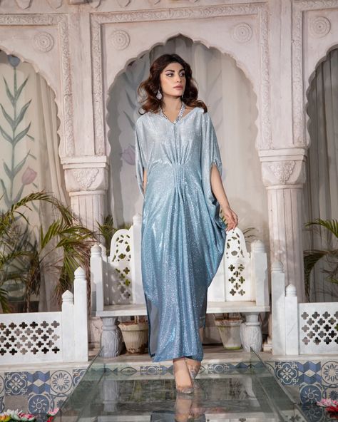 The MOONLIGHT - 2 Piece Kaftan is a must-have for any formal occasion. With its blingy design and sequence fabric, this kaftan is perfect for adding a touch of glamour to your evening look. Plus, it's perfect for night photography, making it a versatile and stylish choice. Fabric: Moonlight Includes: Kaftan and trousers  Length: 52"-53" Model's height: 5'9 ***PLACE YOUR PRE-ORDERS BY 29TH MARCH 2024 FOR GUARANTEED DELIVERY BY EID*** #readytowear #Pakistaniwedding #Pakistanibride #Moder... Sequence Fabric, Kaftan Design, Blue Kaftan, Kaftan Styles, Evening Look, Modest Wear, Photography Lighting, March 2024, Versatile Outfits