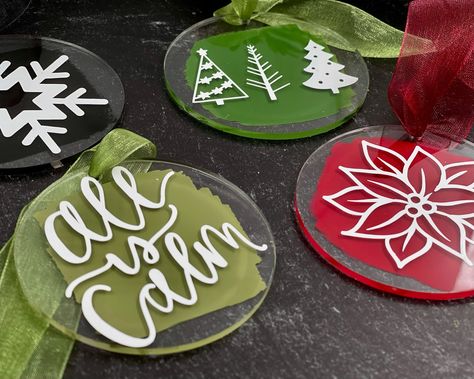 "Deck your tree with these gorgeous acrylic ornaments! Pick from seven patterns and 4 paint colors for the smear on the backside. Ornament measures 3\" in diameter, and comes with a sheer organza ribbon to tie to your tree, matching the color of your choice of paint color. Listing is for 1 ornament only. Photo props are not included. Don't forget to \"Favorite My Shop\" so you will see all my new listings in your Etsy news feed and I will be listed in your favorites for quick and easy access for your browsing convenience!" Acrylic Holiday Ornaments, Acrylic Blank Christmas Ornaments, Painting Acrylic Ornaments, Clear Flat Ornament Ideas, Acrylic Painted Ornaments, Christmas Cricut Ornaments, Diy Acrylic Ornaments Christmas, Acrylic Rounds Ideas, Acrylic Ornaments Cricut