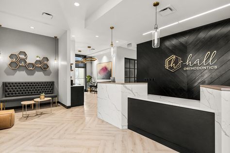 Black And Gold Dental Office, Beautiful Dental Offices, Office Foyer Design Entrance, Dental Office Waiting Room Ideas, Chamber Of Commerce Logo Ideas, Luxury Medical Office, Modern Doctors Office Waiting Rooms, Black And White Dental Office, Medical Office Reception Design