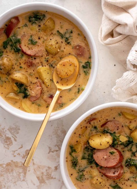 This smoked sausage potato soup is incredibly creamy, satisfying and delicious! Smoked sausage rounds with tender potatoes and kale come together in this cozy, comforting bowl that everyone loves. Tastes amazing! Smoked Sausage Stew Recipes, Smoked Sausage Potato Soup, Apple Oatmeal Breakfast, Fontina Grilled Cheese, Grilled Garlic Bread, Citrus Slaw, Sausage And Potato Soup, Sausage Potato Soup, Winter Lunch