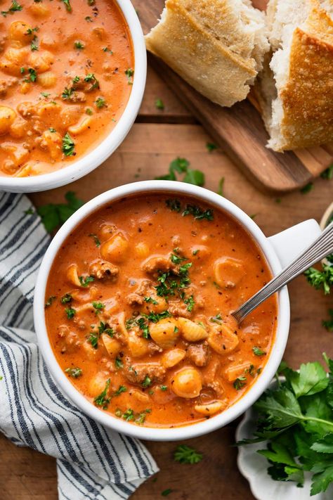 Creamy tomato soup with ground beef and noodles is an easy one-pot dinner that's ready in less than 45 minutes! Add a loaf of crusty bread or a simple green side salad for a delicious and family-friendly weeknight meal. Tomato Soup With Ground Beef, Tomato Soup With Noodles, Tomato Mac Soup, Ground Beef And Tomato Soup, Tomato Mac Beef Soup, Ground Beef Rice Tomato Soup, Beef And Tomato Soup, Beef Tomato Macaroni Soup, Creamy Ground Beef And Macaroni Tomato Soup