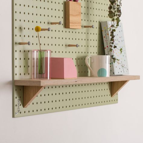 Our Fixed Wooden Shelf is a must-have addition for your pegboard board, adding extra functionality and storage.The Wooden Pegboard Shelf uses a clever design that allows it to slot neatly into the holes on our pegboards, making it an incredibly versatile storage solution.The wooden pegboard shelves are beautifully hand-finished in our UK studio in Cornwall, designed to perfectly fit the 6mm holes in our collection of pegboard boards.A useful addition to personalise a hallway pegboard, the shelve Hallway Pegboard, Decorative Pegboard, Pegboard Shelves, Pegboard Shelf, Large Pegboard, Pegboard Ideas, Wooden Pegboard, Expo Ideas, Media Shelf