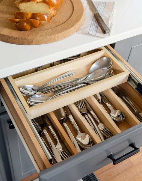 Boost kitchen organization inside your silverware drawer with custom inserts. Here, dividers sort forks, knives, and spoons, and a second tier slides into view when needed. #kitchenstorage #pulloutkitchenstorage #kitchenideas #kitchenstorageideas #bhg Cleaning Silverware, Organize Utensil Drawer, Clean Silverware, How To Clean Silverware, Silverware Storage, Kitchen Utensil Storage, Kitchen Pots, Utensil Drawer, British Wedding