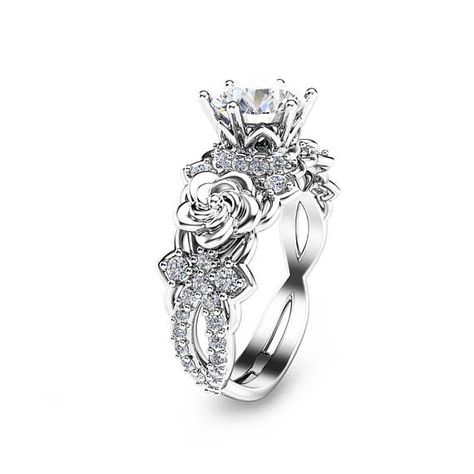 For impeccable style, you simply cannot go wrong with this 14K white gold diamond engagement ring from Camellia Jewelry. Hand-forged in stunning detail, the mounting resembles a flower deco as it elevates the floral accents and sparkling conflict free natural diamond in luminous Gold Floral Engagement Ring, Moissanite Engagement Ring Gold, Rose Wedding Rings, Gold Moissanite Engagement Ring, Lab Created Diamond Rings Engagement, Flower Wedding Ring, Engagement Ring Gold, Floral Engagement Ring, Engagement Ring Unique