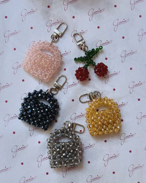 Cute little key chains 🍒👜 Carry it as a keychain or bag accessory. Handmade with love♥️ Dm to shop🛒 #gurria #ketchain #bagaccessories #handmade #cherry #crystal #crystalbag #crystalcherry #beads #india Key Chains Beads Keychain Ideas, Key Chains Diy Handmade, Beads Bags Handmade, Beaded Keychain Diy, Diy Bag Charm, Beads Keychain, Hand Beaded Bag, Bead Keychain, Bead Bag