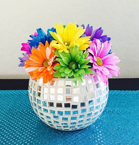 13 DIY Disco Ball Inspired Projects for the True Dancing Queen 70s Centerpiece Ideas Diy, One Year Old Disco Party, 60s Party Centerpieces, 70s Theme Centerpiece Ideas, 60s Centerpiece Ideas, 70s Decor Party, 70s Disco Party Decorations Table Centerpieces, 70s Party Decorations Ideas, 70s Centerpieces