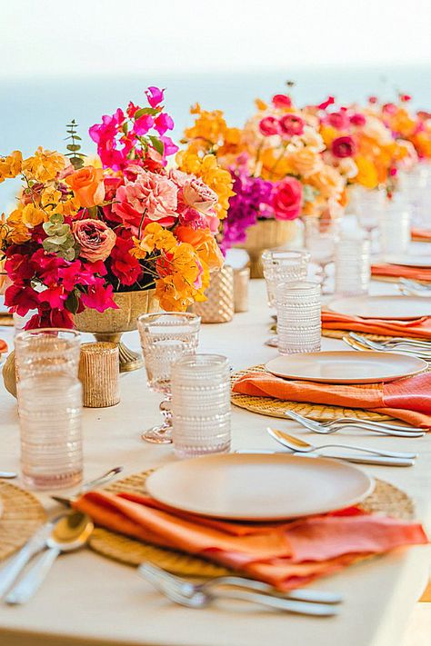 Explore the bridal table setting for your wedding.#bridalinspo#eventdecor#bride Bright Floral Table Decor, Mexico Wedding Reception Decor, Vibrant Table Setting, Mexican Inspired Flower Arrangements, Colorful Floral Arrangement Centerpiece, Bright Floral Tablescape, Bright Flower Wedding Decor, Vibrant Wedding Centerpieces, Sunset Color Flower Arrangements