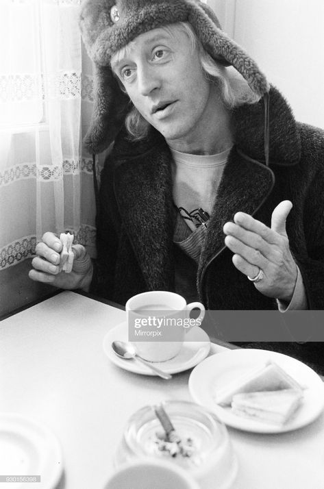 Jimmy Savile Day In the Life Feature 1971  A day in the life of Jimmy Saville' Feature by Mike Hellicar. Here he is pictured in a railway cafe, which he uses for meals and as an office, 7th October 1971. (Photo by Ron Burton/Mirrorpix/Getty Images) Jimmy Saville, Jimmy Savile, Day In The Life, Pinterest Board, Bad Boy, Paper Clip, Halloween Outfits, Pumpkin Carving, Documentaries