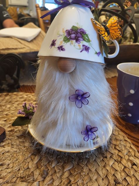 Tea cup gnome. Request for violets.  Her husband passed ..si I added a 🦋 Teacup Gnomes Diy, Teacup Gnomes, Tea Cup Gnomes, Cup And Saucer Crafts, Teapot Crafts, Recycled Christmas Decorations, Gnome Crafts, Teacup Crafts, China Crafts