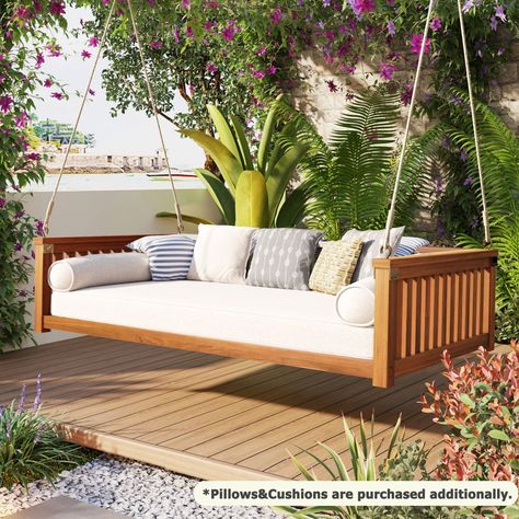 Our elegant swing bed design embodies minimalist style, seamlessly blending with any outdoor environment to enhance both modern and traditional landscapes. The clean lines and understated design create a tidy, calming atmosphere, perfect for relaxation. Made from high-quality acacia wood, known for its weather resistance and beautiful grain, this swing bed offers both durability and style. It accommodates a twin-size mattress (mattress not included, to be purchased separately), providing ample space for relaxation. Whether resting on a sunny afternoon or stargazing at night, this swing bed is the ideal spot to unwind. The swing's sturdy structure supports up to 350 lbs, with an angled design that features a higher front and lower back, adding both comfort and safety. Please note: The swing Daybed Swings Outdoor, Hanging Seat, Hanging Seats, Wood Porch, Beach House Furniture, Swing Bed, Patio Swing, Bed Wood, Futon Bed