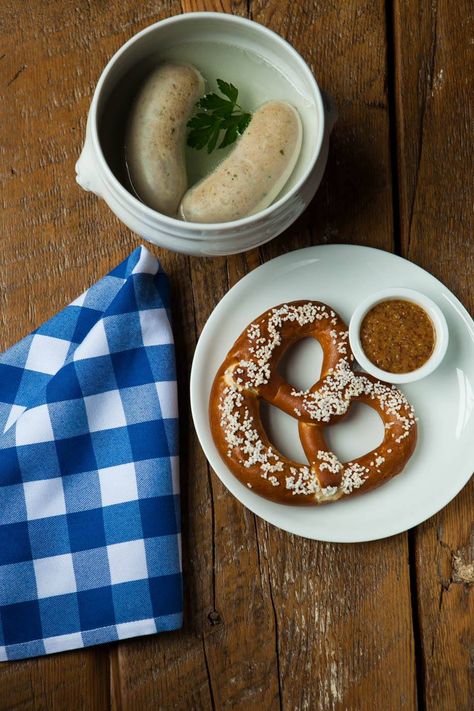 A classic Bavarian breakfast weisswurst white sausage is traditionally made of a pork & veal mixture steamed or poached served in a bowl of water with a pretzel sweet mustard + a glass of hefeweizen beer. one cuts the sausage in half & squeezes the meat out of the casing which is not eaten. White Sausage, Burger Dogs, Best Sausage, European Cuisine, Crispy Pork, How To Make Sausage, German Food, Sausage Breakfast, Foodie Travel