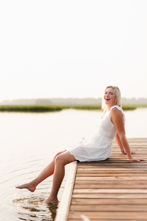 white dress green floral pattern dress short heels dock by the water low country marsh boat ramp Doc Picture Ideas, Dock Photoshoot Ideas, Senior Picture Ideas Dock, Senior Pictures On A Dock, Boat Dock Senior Pictures, Senior Photos On A Dock, Senior Photos By Water, Senior Pictures At The Lake, Boat Dock Photoshoot