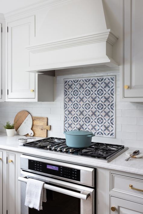 White ceramic subway tile backsplash with a hand-painted marble accent above the stove creates a stunning focal point.

Photography | Christy Kosnic Photography

#CeramicSubwayTile #KitchenFocalPoint #InteriorDesign #TwoNavyLane #HomeDecor #KitchenInspo #TileDesign #HandPaintedAccent #InteriorStyling #BeautifulKitchen #KitchenGoals #HomeRenovation #KitchenDesign #DesignElegance #InteriorInspiration #HomeStyling #KitchenChic #FunctionalKitchen #StylishKitchen #KitchenUpdate Kitchen Backsplash Stove Accent, Ceramic Subway Tile Backsplash, Backsplash Subway Tile, Off White Kitchen, Off White Kitchen Cabinets, Focal Point Photography, Point Photography, Off White Kitchens, Accent Backsplash