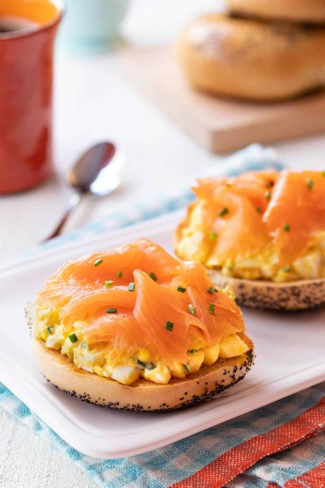 Tasty and colorful, Toasted Bagels with Egg Salad and Smoked Salmon are my husband Robert’s favorite breakfast. A big tangy, a a bit smoky and full of flavor, they are quick and easy to prepare. And, the egg salad can be make ahead, too! #bagelsandwiches #eggsaladrecipe #smokedsalmon #easybreakfastrecipes Salmon Egg Salad, Salmon Bagels Smoked, Bagels With Smoked Salmon, Bagel Smoked Salmon Cream Cheeses, Smoked Salmon Bagel Breakfast, Bagels And Lox Recipe Smoked Salmon, Egg Bagel, Salmon Breakfast, Salmon Bagel