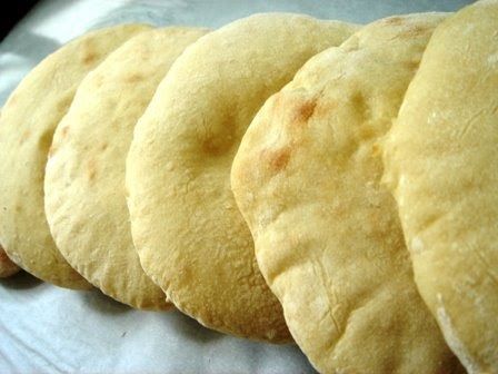 The dough in this pita recipe is mixed by a bread machine. I own a Sunbeam bread machine  , and the small investment ($60) was very much wo... Pane Pita, Homemade Pita, Homemade Pita Bread, Pita Recipes, Flat Breads, Pita Bread, Chapati, Bread Machine, Bread Dough