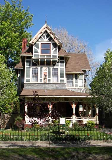 Franklin W. Caulkins House  415 Franklin Street, Buffalo, N. Y.  Erected:1882  Architect:Franklin W. Caulkins  Style:Stick / Eastlake        Asymmetrical      The Eastlake porch supports its roof on massive knobbed posts and a spindle balustrade interrupted by decorative cut-outs Stick Eastlake House, Eastlake House, New York Houses, Porch Supports, Modern Log Cabins, Victorian Modern, Craftsman Bungalows, Buffalo New York, Log Cabins