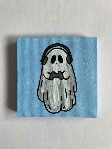 "3\"x3\" Hand Painted Gamer Ghost Canvas Painting This small ghost painting is the perfect addition to your decor.  Hand painted on a 3\"x3\" canvas with acrylic paint, each painting is one of a kind. These paintings are made to order and may vary slightly.  A great gift for a friend or family member or perfect just for you!" Video Game Painting Canvas, Gamer Painting Ideas, Canvas Art Painting Acrylic Ideas, Ghost Halloween Painting, Gaming Painting Ideas, Video Game Painting Ideas, Painting Ideas On Canvas Ghost, Easy Cute Painting Ideas On Canvas, Cool Stuff To Paint