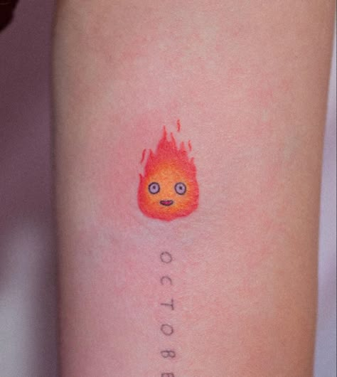 CALCIFER - HOWLS MOVING CASTLE (bongkee_ on instagram) Tiny Calcifer Tattoo, Small Calcifer Tattoo, Hals Moving Castle Tattoo, Ghibli Tattoo Minimalist, Calcifer Tattoo, Howl's Moving Castle Tattoo, Miyazaki Tattoo, Tatuaje Studio Ghibli, Ram Tattoo