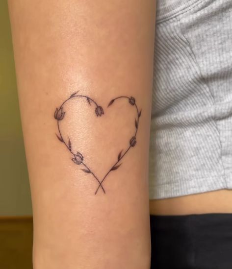 Heart, tattoo, fine line tattoo, tulips, flowers, tiny tattoos Heart Made Out Of Flowers Tattoo, Heart With Tulip Tattoo, Fine Line Heart Tattoo With Flowers, Tattoo Flower Heart, Heart Leaves Tattoo, Fine Line Tattoo Ideas Arm, Daffodil Heart Tattoo, Tulip Heart Tattoo, Tulip And Daisy Tattoo