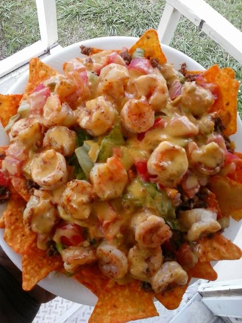 OMG Shrimp & Beef Nachos: Layer spicy Doritos, taco seasoned ground beef, tomatoes, lettuce, black olives, grilled shrimp and nacho cheese sauce Ground Beef Nachos Recipe, Beef Nachos Recipe, Beef And Shrimp, Spicy Doritos, Ground Beef Nachos, Shrimp Nachos, Nachos Recipe Beef, Doritos Taco, Beef Nachos