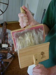 Carding--Ouch!  Just looking at her holding the cards like this makes my arms and hands hurt. Carding Wool, Wool Spinning, Hantverk Diy, Artisan Yarn, Shetland Sheep, Spinning Wool, Spinning Wheels, Spinning Yarn, Native Beadwork