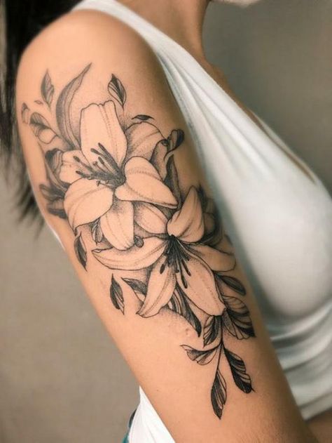 90 Awesome Lily Tattoo Designs with Meaning | Art and Design Lily And Wildflower Tattoo, Lily Arm Tattoo For Women, Fineline Lily Tattoo, Black And White Lily Tattoo, Water Lily Tattoo Sleeve, Lily Floral Tattoo, Flower Piece Tattoo, Lily Forearm Tattoo, Floral Black Work Tattoo