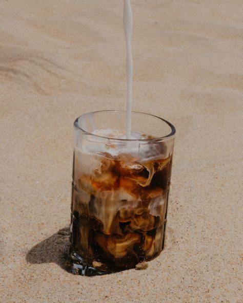 Daybreaks iced coffee at the beach #coffee #beach #latte #beverages #drink #aesthetic Beach Coffee Aesthetic, Coffee Beach Aesthetic, Coffee Beans Aesthetic, Cafe By The Beach, Coffee By The Beach, Cocnut Milk, Coffee And Alcohol, Coffee On The Beach, People Drinking Coffee