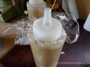 I put a piece of saran wrap under the lid to keep the mixture from leaking out of the bottle in the freezer Butter Stuffing, Kong Stuffing Recipes, Low Calorie Peanut Butter, Kong Treats, Kong Stuffing, Kong Recipes, Puppy Biting, Frozen Dog, Dog Enrichment