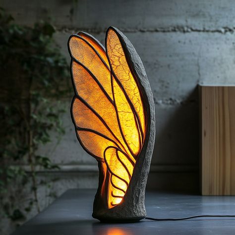 This lamp, inspired by the delicate structure of insect wings, brings a touch of nature’s elegance into your home. The lampshade mimics the intricate patterns found in the wings of dragonflies or butterflies, with translucent panels that softly diffuse light, creating a warm and inviting glow. The design features a lightweight, airy frame that captures the fragility and grace of the natural world, while the lamp’s organic curves and subtle textures evoke the sense of being surrounded by natur... Firefly Wings, Foldable Ideas, Unique Pic, Neon Decorations, Butterfly Lamp, Lamp Inspired, Insect Wings, Tree Lamp, Neon Decor