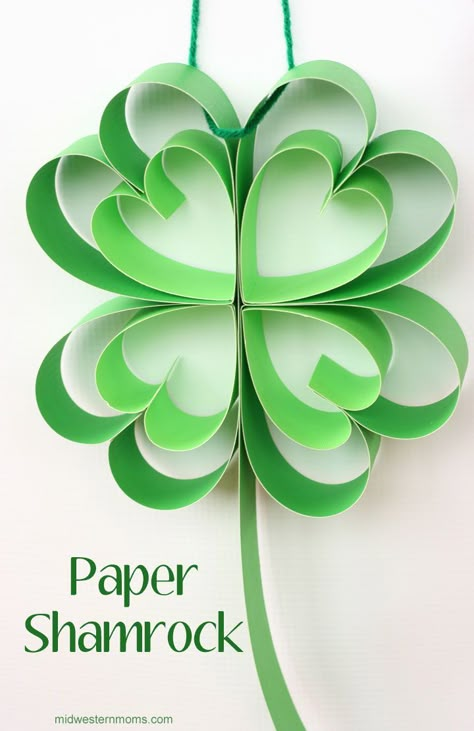 How to make a paper shamrock | from Midwestern Moms --- Easy St. Patrick's Day decoration, would be cute for spring in general Diy St Patricks Day Decor, Sant Patrick, Shamrock Craft, Fete Saint Patrick, St Patricks Day Crafts, St Patricks Crafts, March Crafts, St Patricks Day Crafts For Kids, St Patrick Day Activities