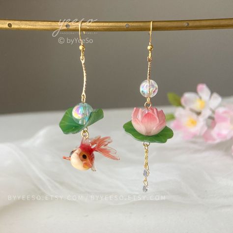 Lotus and Fish Earrings, Lily pad and Lotus flower dangle earrings, water lily Lotus earrings 🤍 Hypoallergenic 🌸 Handmade with love ✨ Cute & Dainty  🎁 Gift ready 〰️Click👇🏻 Find more Earrings🎀  https://www.etsy.com/shop/byYeeSo ◽️ PACKAGING ◽️  * The jewelry will be nicely packaged * Comes with a drawstring suede pouch * If you need personalized gift note, please click the link below, add it to your cart when check out to upgrade your packaging. https://www.etsy.com/listing/1008661207/upgra Lotus Accessories, Lotus Flower Earrings, Koi Fish Earrings, Water Lily Earrings, Water Lily Necklace, Koi Fish Earring, Lily Lotus, Headpiece Accessories, Lotus Jewelry