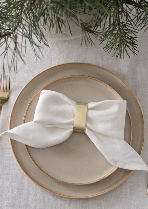 "Add a touch of understated elegance to your table decor with this white linen napkin set. Handcrafted of premium quality European flax, our cloth napkins will get softer and better over time. Finished with a classic mitered corner, these table linens are destined to become an elevated staple of your home. Mix and match or coordinate linen tablecloths to create a complete tablescape. DETAILS - Sold in sets of 4, 6, or 10 napkins - Napkin size: 18x18\" (45x45 cm) - Handmade from premium quality E Christmas Napkin Folding, Dinner Party Gifts, Cloth Napkin Folding, Homemade Gift Baskets, Creative Napkins, White Linen Napkins, Elegant Baby Shower, White Napkins, Christmas Napkins