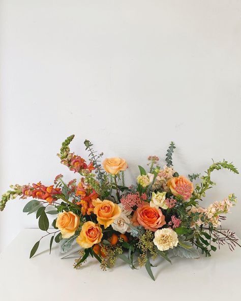 Orange Fall Centerpieces, Low Profile Floral Centerpieces, Horizontal Floral Design, Large Flower Centerpieces Wedding, Low Centerpieces Wedding Long Table, Orange Flower Table Arrangements, Low Table Arrangements, Long And Low Table Arrangement, Parallel Floral Arrangement