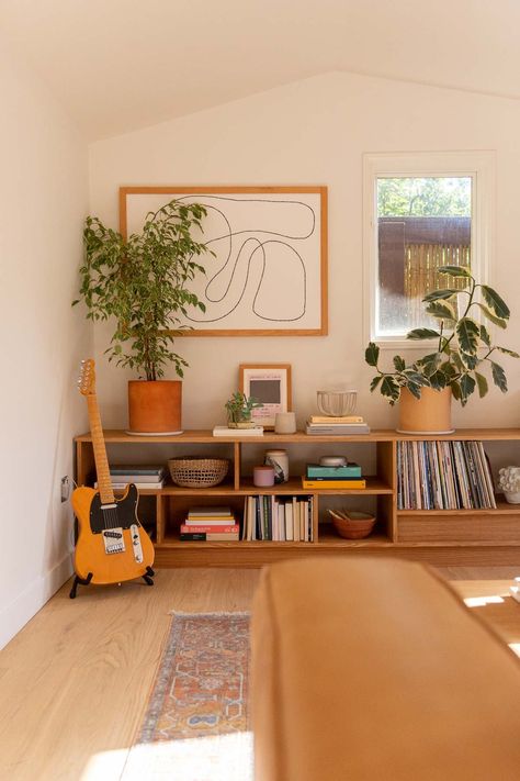 Making Bookcases Look Built In, Diy Mcm Bookcase, Mid Century Built In Bookshelves, Low Bookshelves Living Room, Bookshelf Next To Tv, Diy Living Room Shelves, Simple Eclectic Home, Bookshelf Under Window, Unique Built Ins