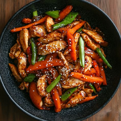 🌶️🍲 Spice up your meals with this quick and tasty Spicy Gochujang Stir-Fry—packed with flavor and heat! 😋 #GochujangStirFry #KoreanCuisine Spicy Gochujang Stir-Fry Ingredients: Chicken breast (500g, sliced) Gochujang (Korean red pepper paste, 2 tbsp) Soy sauce (2 tbsp) Garlic (3 cloves, minced) Bell pepper (1, sliced) Carrot (1, julienned) Green onion (2 stalks, chopped) Sesame oil (1 tsp) Sugar (1 tsp) Sesame seeds (for garnish) Instructions: Heat sesame oil in a pan and sauté garlic unt... Stir Fry Ingredients, Trending Recipes, Sesame Seeds, Stir Fry, Tasty Dishes, Chicken Breast, Stuffed Bell Peppers, Spice Things Up, Carrots