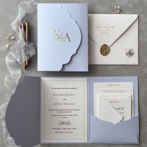 * DETAILS: Timeless elegance and grandeur are showcased in these classic sky blue pocketfold invitations, featuring elegant detailing in white and gold. Crisp print on premium matte paper, combined with luxurious gloss gold foil stamping will impress your guests at first glance. It is perfect for traditional weddings or modern couples wanting a classy, sophisticated theme without intricate patterns. Sky Blue Vertical pocketfold invitations feature gold foil initials on the cover of a tri-fold po Guest Invitation Cards, Pocket Wedding Invitations Diy, Wedding Invitation Blue And Gold, Blue Themed Wedding Invitations, Tri Fold Invitations, Wedding Invitation Pocketfold, Low Country Wedding Invitations, Wedding Guest Cards, October Blue Wedding