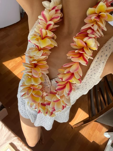 Girl wearing plumeria lei in Hawaii, Summer in hawaii, hawaii summer aesthetic, lei, lei making, plumeria flower, summer aesthetic, summer fashion, pink flowers Flower Summer Aesthetic, Summer In Hawaii, Hibiscus Wedding, Lei Day, University Of Hawaii At Manoa, Aesthetic Summer Fashion, Lei Making, Romance Movie, Lei Lei