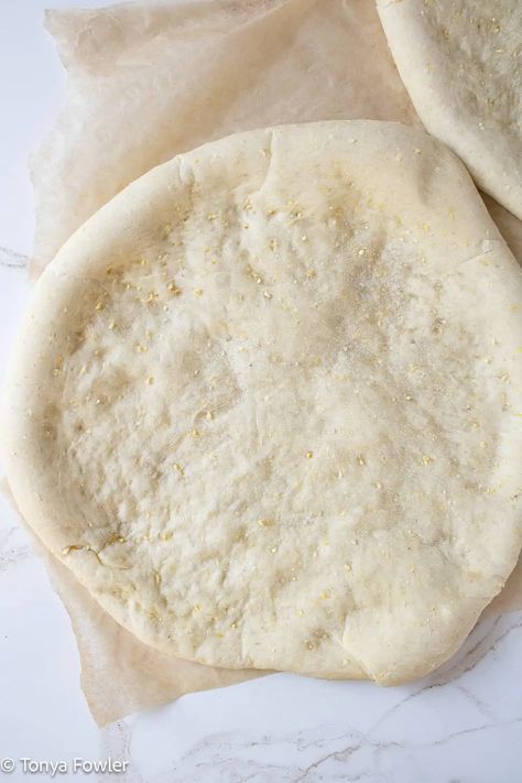 Cornmeal pizza crust on a parchment paper. Whole Grain Pizza Dough, Polenta Pizza Crust, Pizza Dough With Semolina Flour, Quick Pizza Crust, Cornmeal Pizza Crust, Pizza Dough Semolina Flour, Cornmeal Crust, School Pizza, Mix Pizza