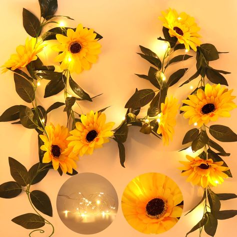 PRICES MAY VARY. 【8 Pcs Large Sunflowers String Lights】- 7.2 FT 20 LED string light. 72 pcs silk leaves and 8 large sunflower heads with 3D printing and stems is made of plastic. Sunflower diameter is 5". Beautiful yellow sunflowers with warm soft yellow light, they will light up your garden or patio and add joyful atmosphere to your party and holiday. 【Light Up your Life】- The artificial plant are the beautiful room decor, you can use it to decor any place you want. Artificial silk flowers and Bedroom Wedding Decor, Vine Lights, Battery Operated Garland, Sunflower Garland, Bridal Party Tables, Led Garland, Battery Operated String Lights, Flowers Hanging, Indoor String Lights