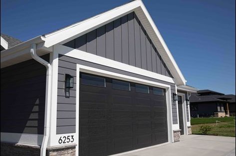 Garage Door Trim Ideas, Door Trim Ideas, House Siding Options, Grey Garage Doors, Dark Grey Houses, Exterior Garage Door, Garage Door Trim, Black Garage Doors, Garage Door Colors