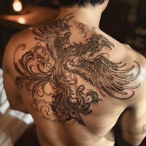 Detailed phoenix tattoo design on man's back symbolizing rebirth and immortality Phoenix Tattoo Men, Phoenix Rebirth, Phoenix Back Tattoo, Rebirth Tattoo, Phoenix Tattoo For Men, Mythical Bird, Phoenix Tattoo Design, Mythical Birds, Shoulder Arm Tattoos